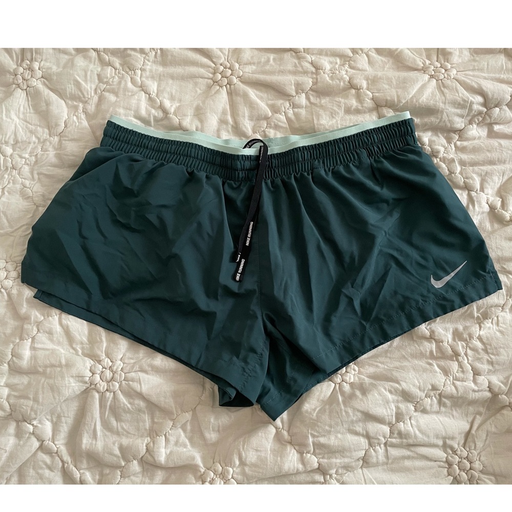 Green running shorts